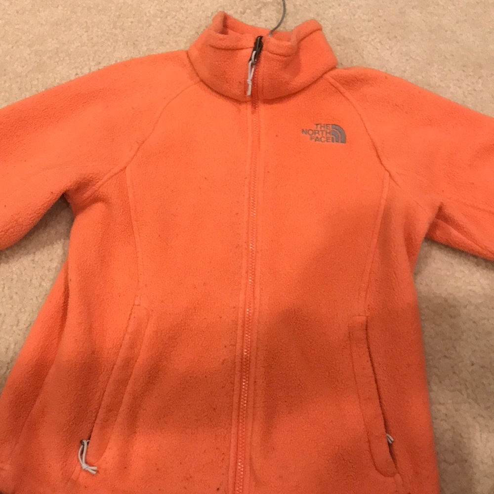 The North Face: Orange zip up jacket: